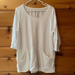 Curved seam pocket tunic